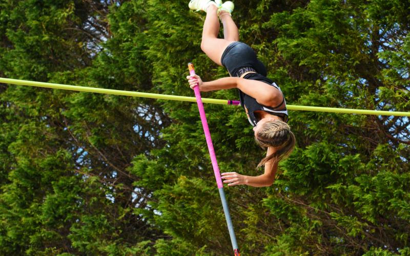 Amelia Johnson goes heels over head to clear a 12-04 pole vault.