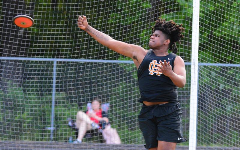 Kanye Fouch sets a school record with a 155-08 discus throw.