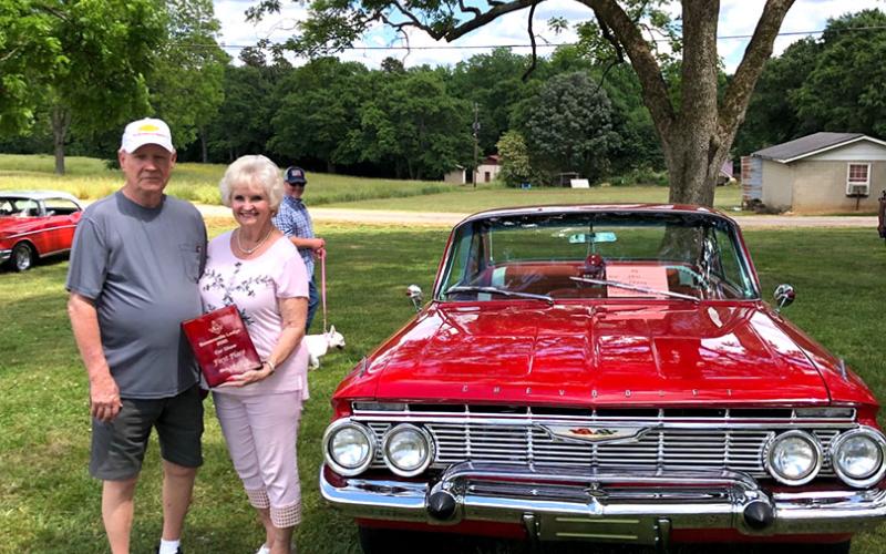 Sammy Bowers and his first place-finishing 1961 Chevy Impala.