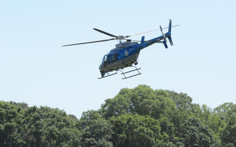 Georgia State Patrol deployed a helicopter Monday afternoon while law enforcement searched for a suspect related to a shooting in the area of Airline-Goldmine Road.