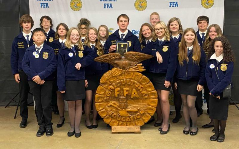 (Pictured, from left to right, are Ashlyn’s father, Brandon Floyd, Ashlyn Floyd, Ashlyn’s mother, Rebecca Floyd, and her brother, Austin Floyd.) Pictured bottom right, Rachel Mize (left), Piper Bond (center) and Ashlyn Stanton (right) all three received their FFA State Degree. This is the highest degree an FFA member can earn while in high school.
