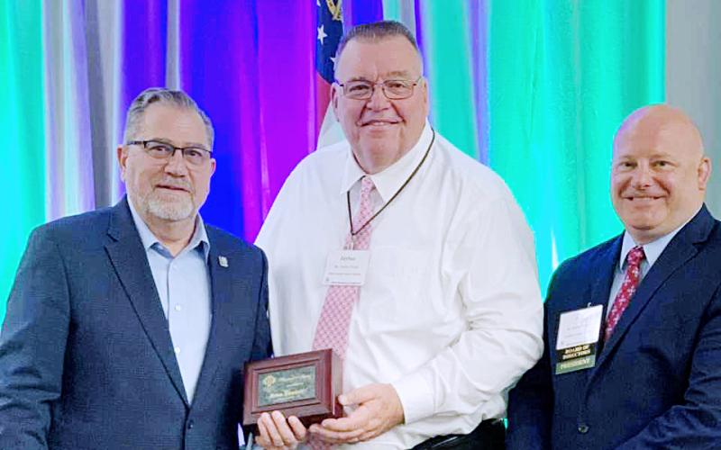 Superintendent Floyd with his award alongside Rob Brown, right, and GSSA Executive Director, left.