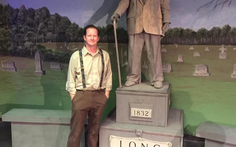 Hartwell playwrite Michael Blackston alongside the prop statue and subject of his original production, “Mr. Long said Nothing.” Blackton’s play, performed by the Hart County Community Theatre, will be available to audiences starting May 13 and run four more nights through May 22.