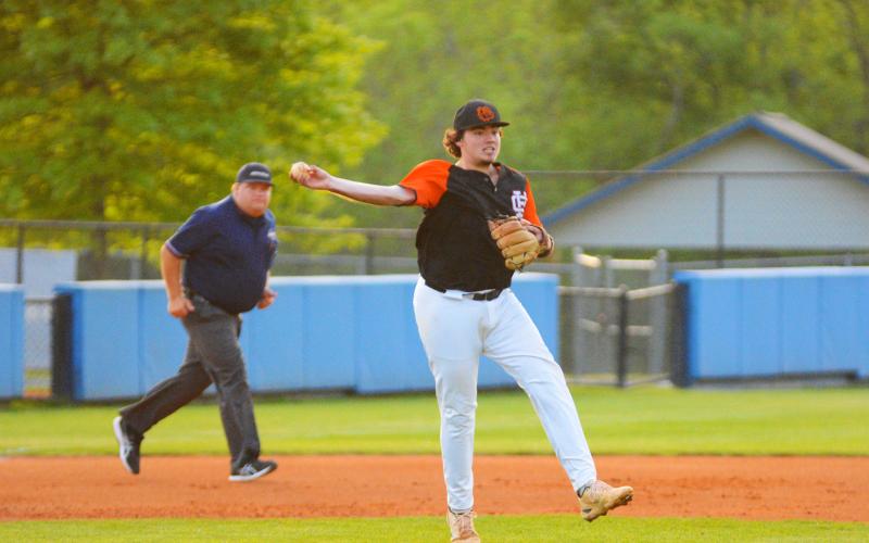 Dean attempts to throw a runner out at first base against Ringgold on April 29.
