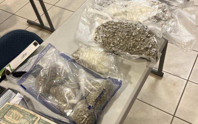 The sheriff’s office recovered a large amount of drugs and cash, pictured above, following a chase through Hart County.