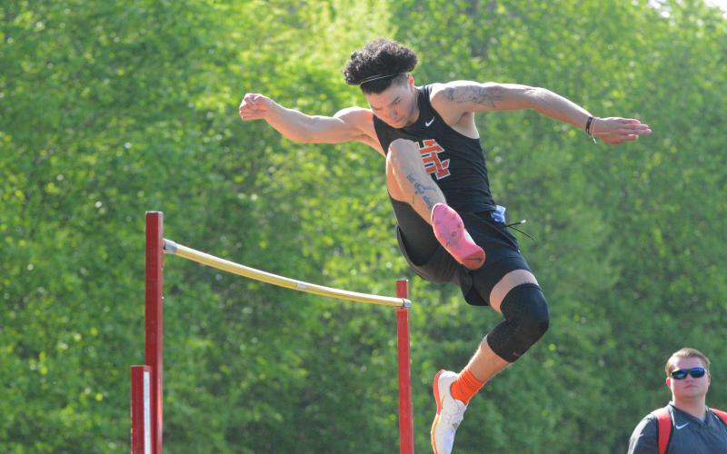 Johnny Curry clears a high jump attempt at the home meet on April 21.