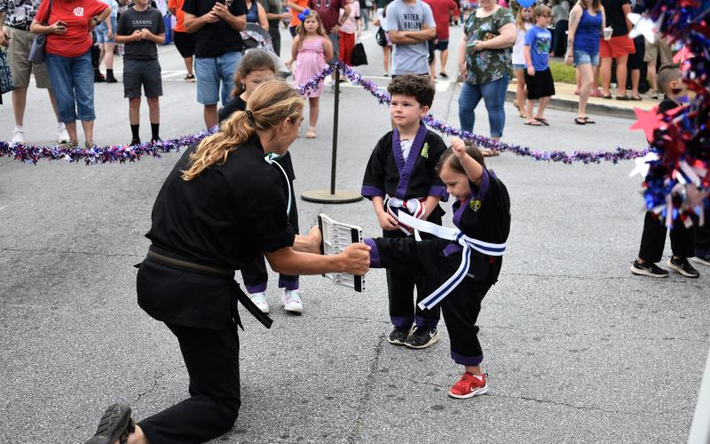 Students of Chuck Cawthorn’s Contemporary Martial Arts show off their skills to the crowd at the Pre-Fourth Festival.