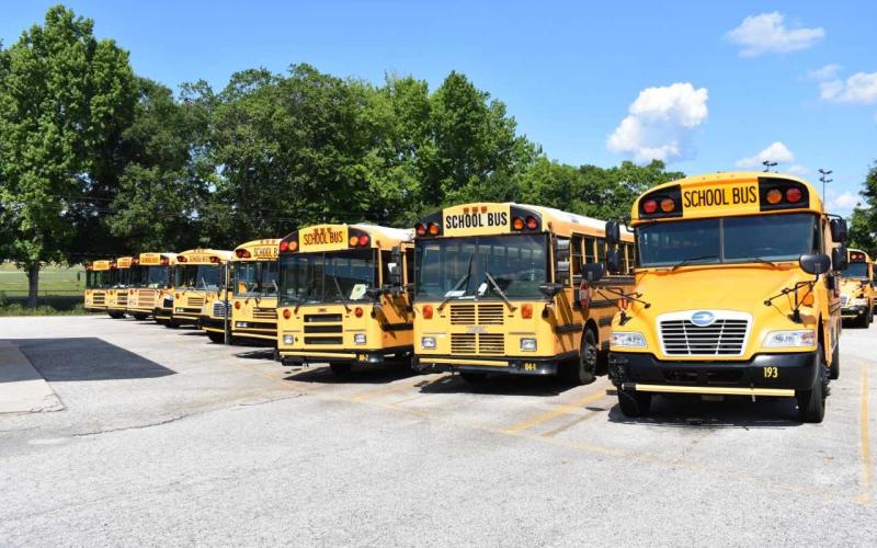 Dawson Baker/The Hartwell Sun - A row of buses sits idle adjacent to Hart County High School. School officials say the school district was spending as much $9,200 on gas per week by the end of the school year.