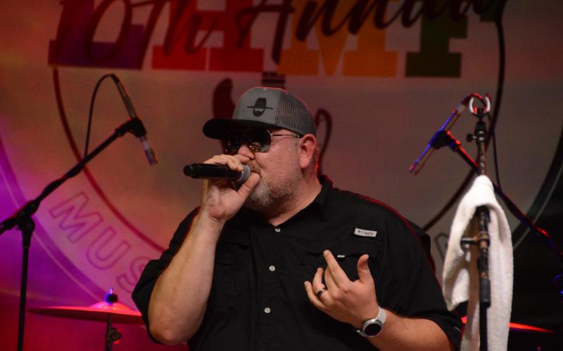 Drew Dotson/The Hartwell Sun - Butch Gibson sings on stage at the Lake Hartwell Music Festival with his band 3 and Twenty.
