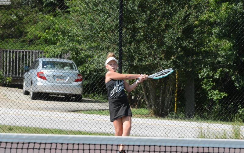 Posie Phillips receives private lessons with Kristen Summers to refine her skills.