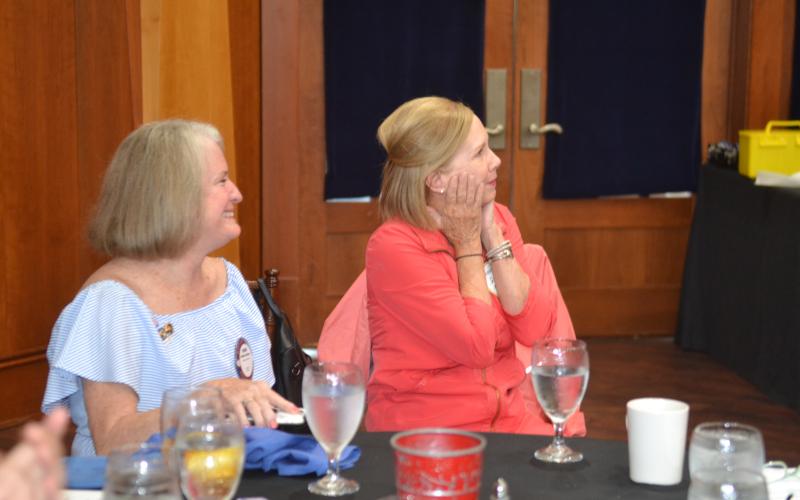 Dan Hunt/The Hartwell Sun DruAnn Williams, right, is shocked upon hearing the news that she was selected for the prestigious Four-Way Test Award. Williams, right, is pictured above at the May 26 Rotary meeting alongside best friend Debbie Kulcsar.