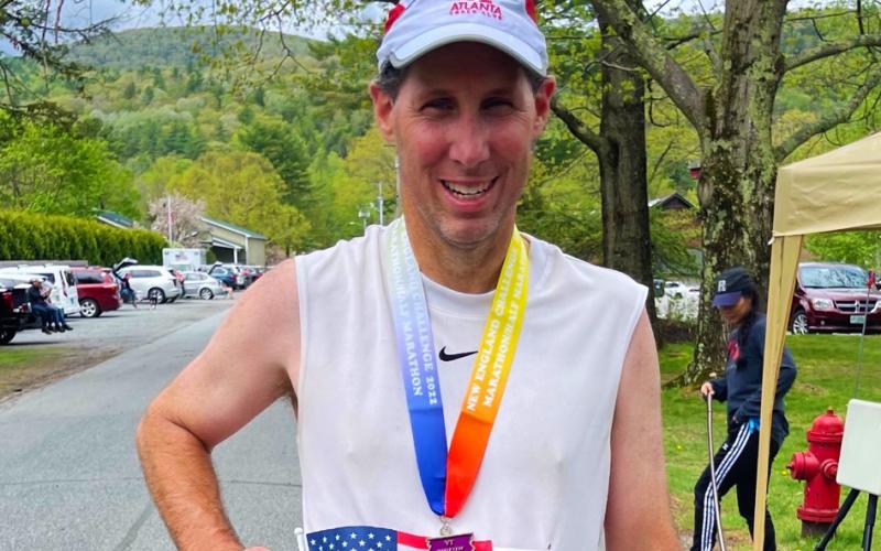 A proud Dr. Wade Walker grins after completing his mission of 50 marathons in 50 states. Walker finished his quest in Vermont on May 15.