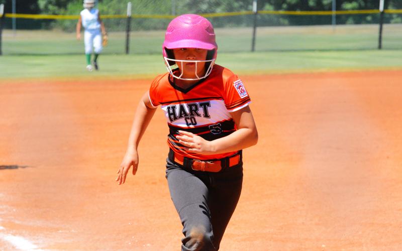Peyton Jordan makes a dash for home plate in the win over Franklin County on June 19.