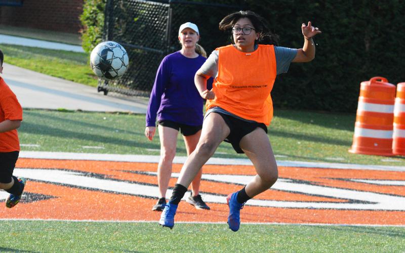 Kami Martinez hits a volley to score a goal.