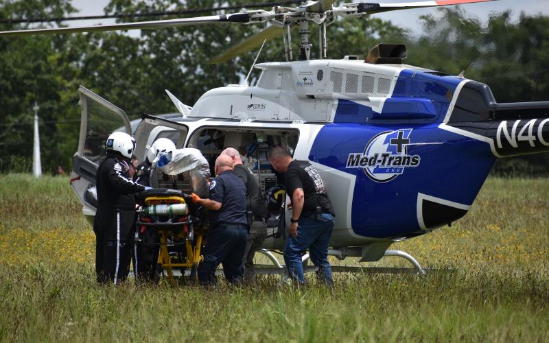 EMS carefully loads burn victim Grayson Webb into an emergency helicopter Tuesday.