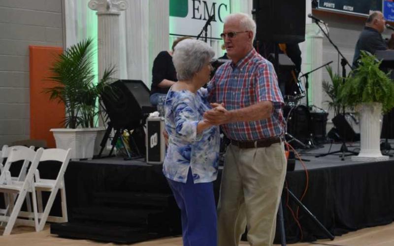 Hartwell resident Vinson Brown dances with wife Patsy Brown prior to the start of the meeting.