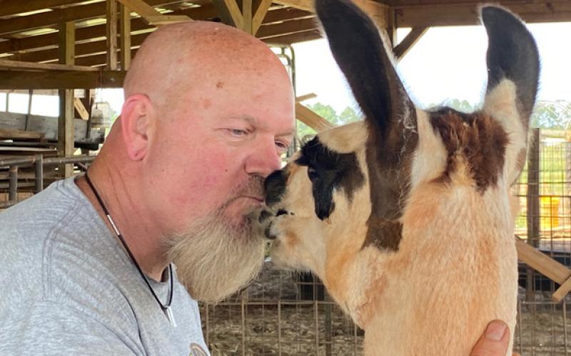 Georgette gives Liam Munore a velvety thank-you kiss for her new, cooler summer haircut.