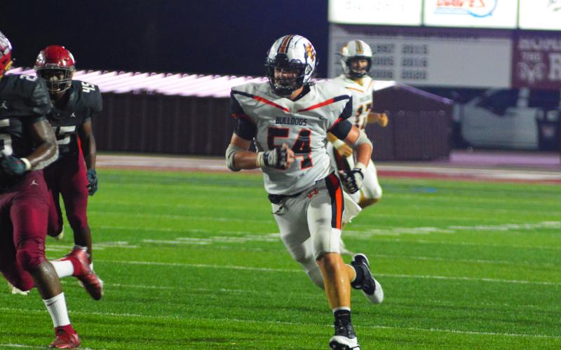 Peyton Powell looks for a block down field against Westside last season.