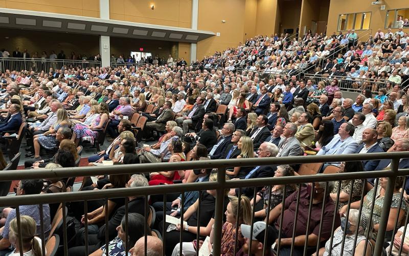 Hundreds of mourners gathered Sunday to honor the memory of Charly and Kelli Schell at the Lonnie Burns Fine Arts Center.