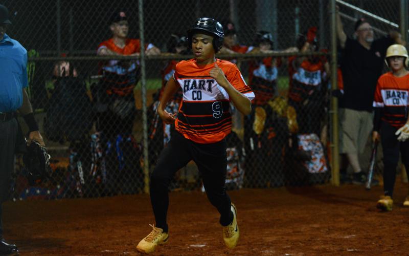 Kaidyn Allen crosses home plate to score against West Point.