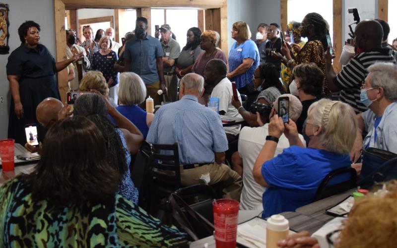 Democratic candidate Stacey Abrams (left) brought her campaign for governor to Royston Thursday, speaking to an overflow crowd at Little Japan Restaurant.