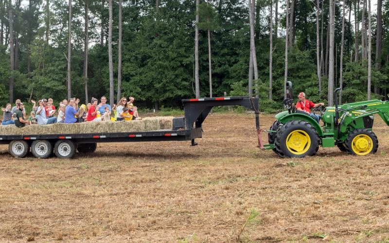 Pictured above is a hayride, sponsored by Wakefield Farm, during the Northeast Georgia Ag Expo held Saturday, Aug. 20 at the Hart County Agriscience Center. The tractor is driven by Nathan Heaton, a Hart County Middle School agriculture teacher.