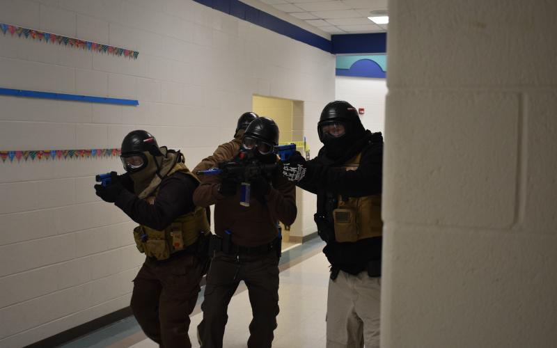 The active shooter training team simulates an active shooter situation. Pictured above, the “good guys” in one of the scenarios.