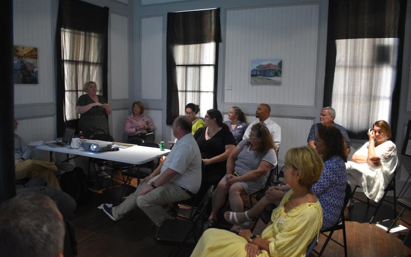 Several community members attend a meeting with the National Main Street program on Wednesday, Aug. 10 at the Hartwell Train Depot.