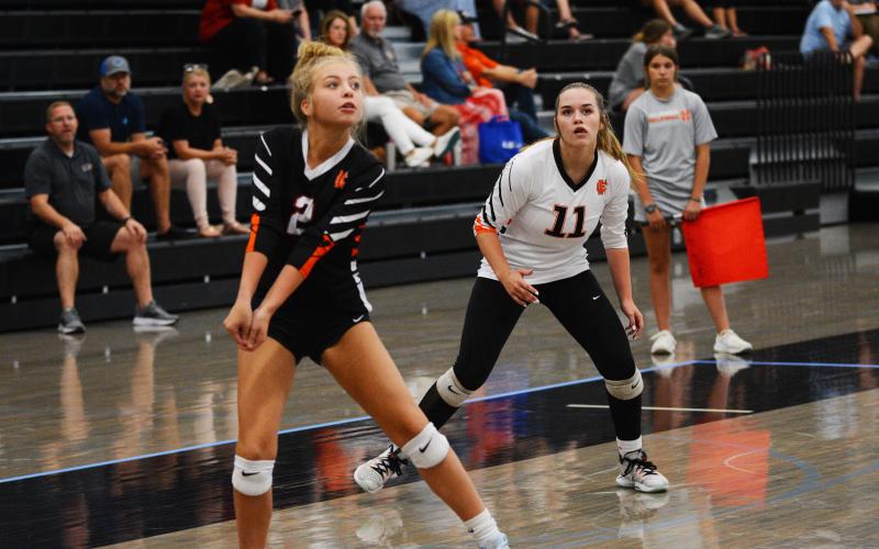 Hannah Harris goes for the reception while Abby Hubbard watches.