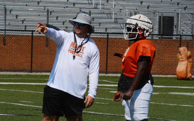 Josh Callicutt gives instructions during a kick return drill.
