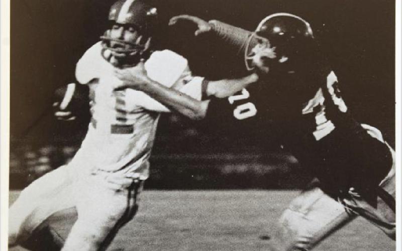 A newspaper clipping of Tash Van Dora as quarterback for Glynn Academy.