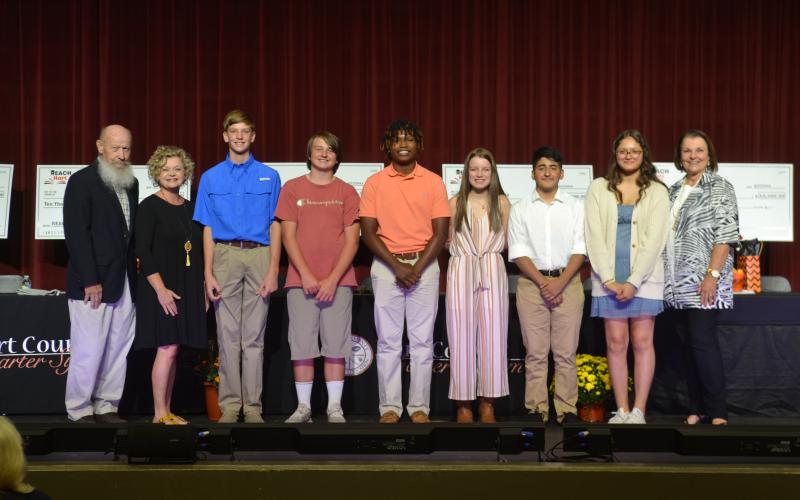 Pictured above is the 2027 REACH Hart Scholar class. From left to right, Hart County Board of Education member Dennis Dowell, Superintendent Jennifer Carter, Tyler Bowers, Dalton Harris, Faustino Rangel, Alana Ramey, Alvin Franco-Gallegos, Edith Rico-Ortiz, and Hart County Education Foundation Executive Director Bobbie Busha.