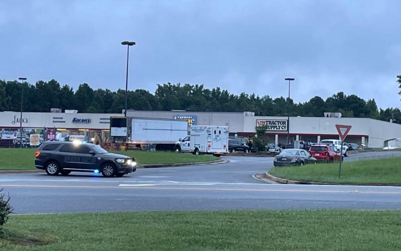 Investigators close off the parking lot at Jack’s Bar and Grill early Monday morning following a shooting which authorities say took place just after 2 a.m.