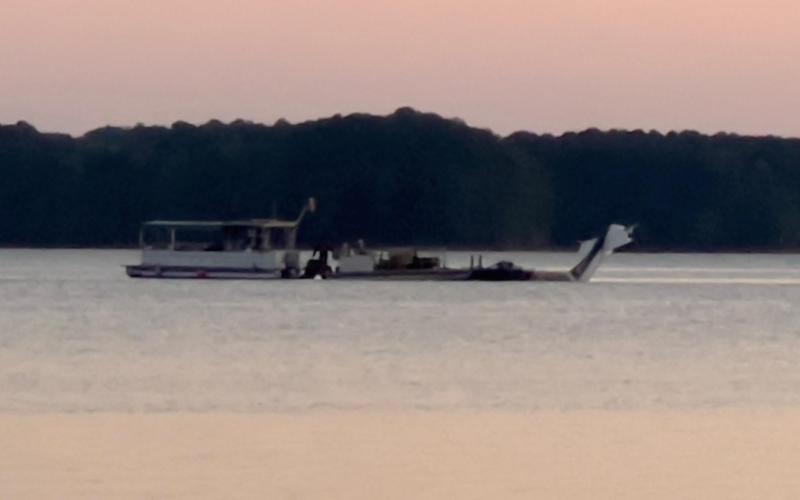 A plane which crashed in Lake Hartwell killing one on Sept. 10 is towed out of the water by specialists on the evening of Sept. 15 after a long recovery operation orchestrated by federal, state, local and out-of-state groups and agencies.