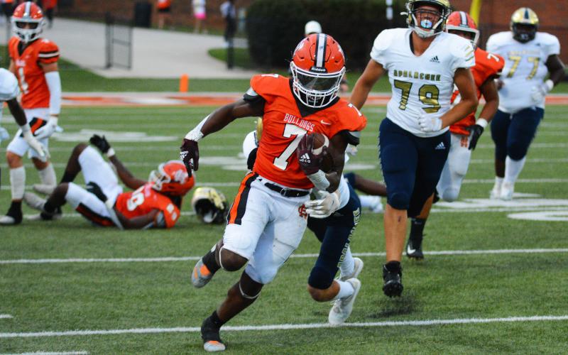 Running back Nori Moore breaks through a tackle for a big run against Apalachee in Hart’s first home game on Friday, Sept. 2.