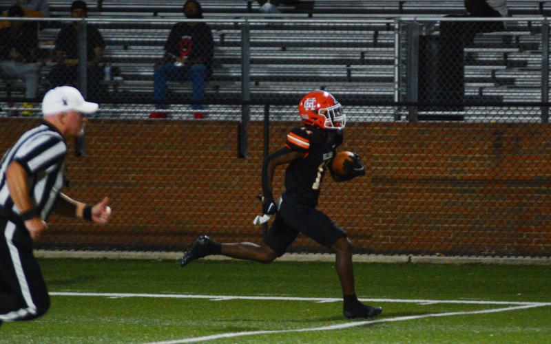 Keith Curry takes his interception to the endzone.