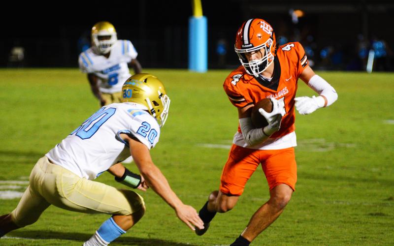 Troup Phillips evades a defender in his best performance of the season on Sept. 9.
