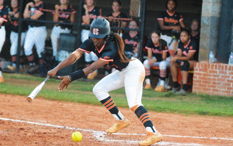 Jakalah Allen slaps the ball in the loss to Stephens County on Sept. 13.