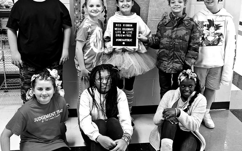 Hart County Middle School students wore “crazy socks and crazy hair” to show that from head to toe they are drugs and bully free. Pictured from left to right are, bottom row, Kimberly Lowney, Jo’niya Glaze, Brandi Harris, back row, Hayden Gunnels, Jacey Barnes, Aubrey Layman, Lance Shaffer, and Kaden Jacobson.