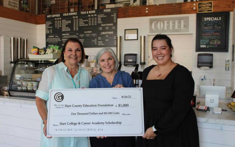 Pictured left to right are Busha, Common Ground owner Ellen East, and Common Ground