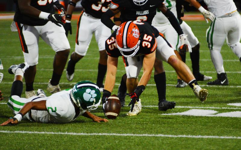 Cyrus Bowen scoops up a fumble on Franklin County’s first offensive possession.