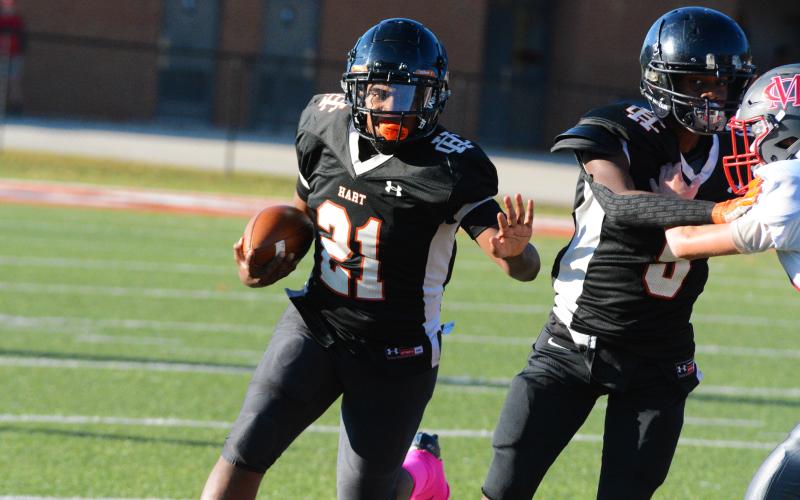 Faustino Rangel runs the ball on the first play of the game against Madison County on Thursday, Oct. 13.