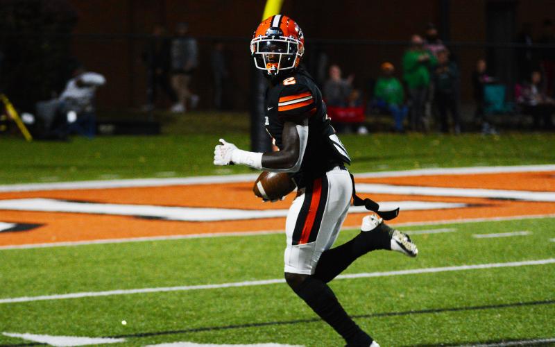 Paul Davis looks over his shoulder as he takes a reception to the endzone.