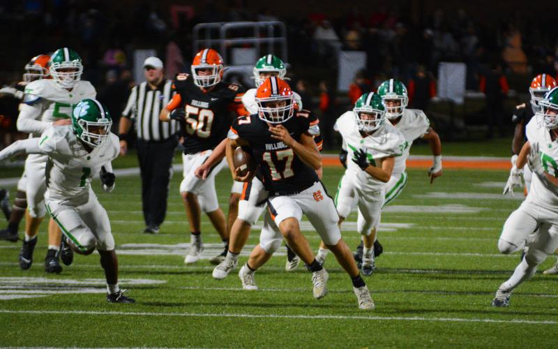 Austen Whitworth runs away from defenders for a touchdown.