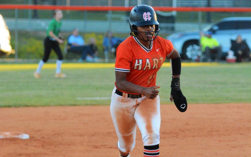 Jazania Shealer runs to third in the final home game of the season.