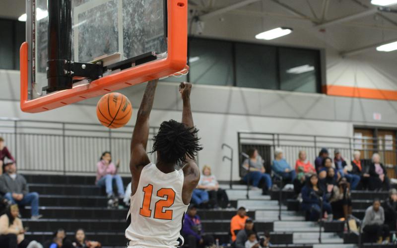 Senior forward Terrance Mitchell slams it home in the Dogs home opener on Nov. 10 against Madison County.