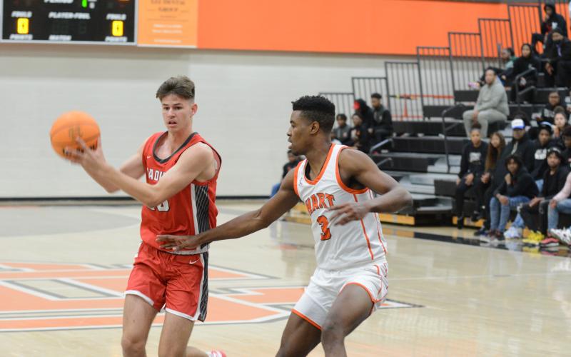 Senior forward Taj Johnson guards a Red Raider closely in the overtime loss, 70-65.