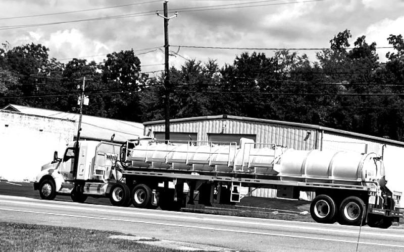 A big-rig-tanker load of industrial waste, aka soil amendment or sludge, sits along the roadside in Lexington.