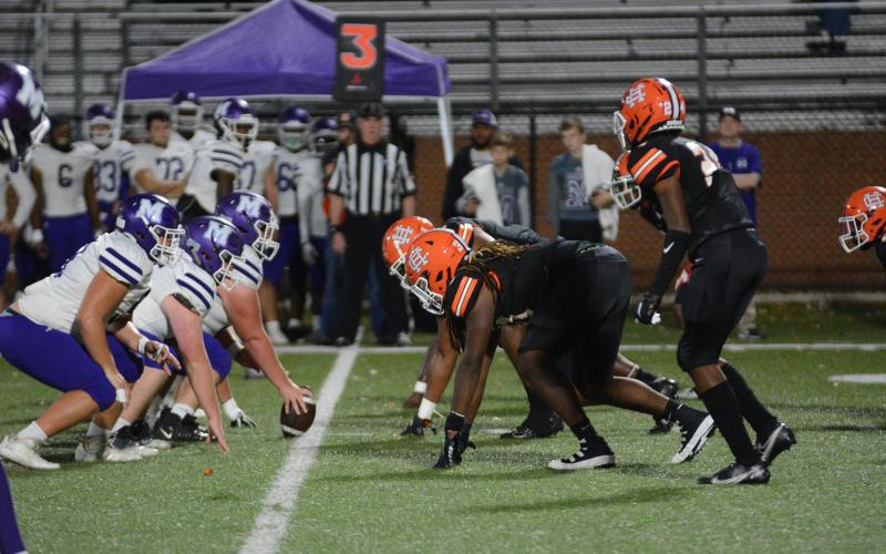The Purple Hurricanes line up offensively against Hart County's defense in a drive.