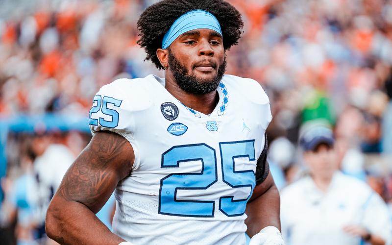 North Carolina Tar Heel Kaimon Rucker trots onto the field before a 36-34 win over Wake Forest which clinched the Coastal Division and an appearance in the ACC Championship vs. Clemson.